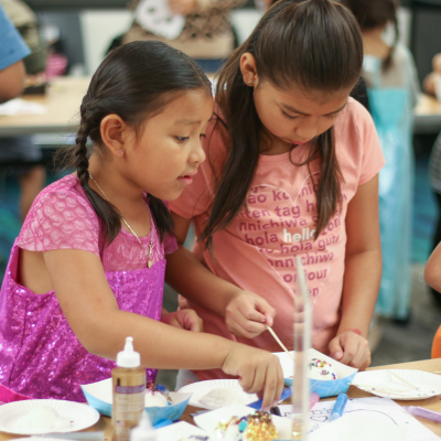 Ponderosa Joint-Use Branch image of children participating in a craft during a program