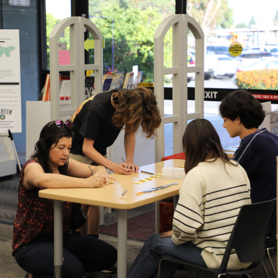 Sunkist Branch image of patrons signing up for a program