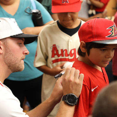 Image at Euclid Branch of children meeting the guest reader & Angel's Baseball player following storytime 