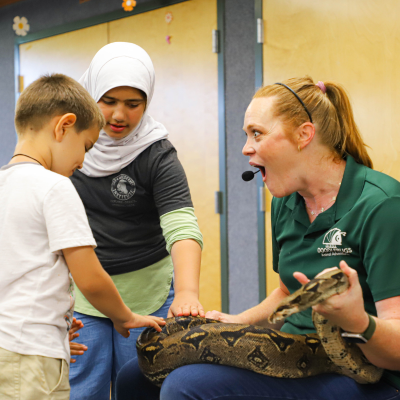 East Anaheim Branch -Image of Doodlebug speaker holding a snake
