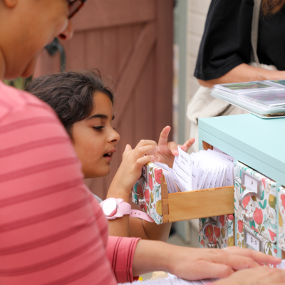 Image of the Seed Library with a child.