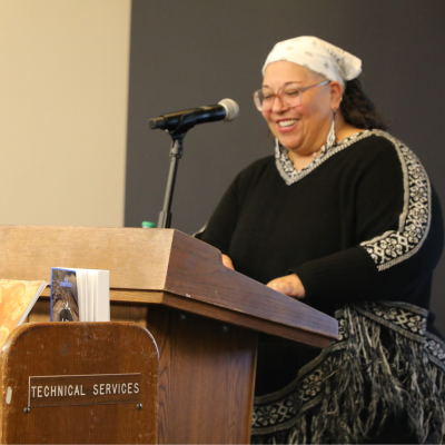 Central Library - Image of a child high-fiving Santa Claus