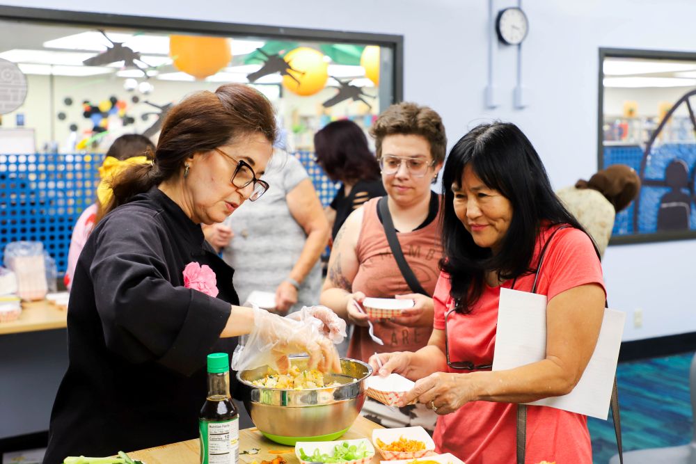 Image of the cooking through american series with food being handed out