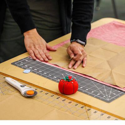 Ponderosa Joint-Use Branch - Image of a woman measuring fabric